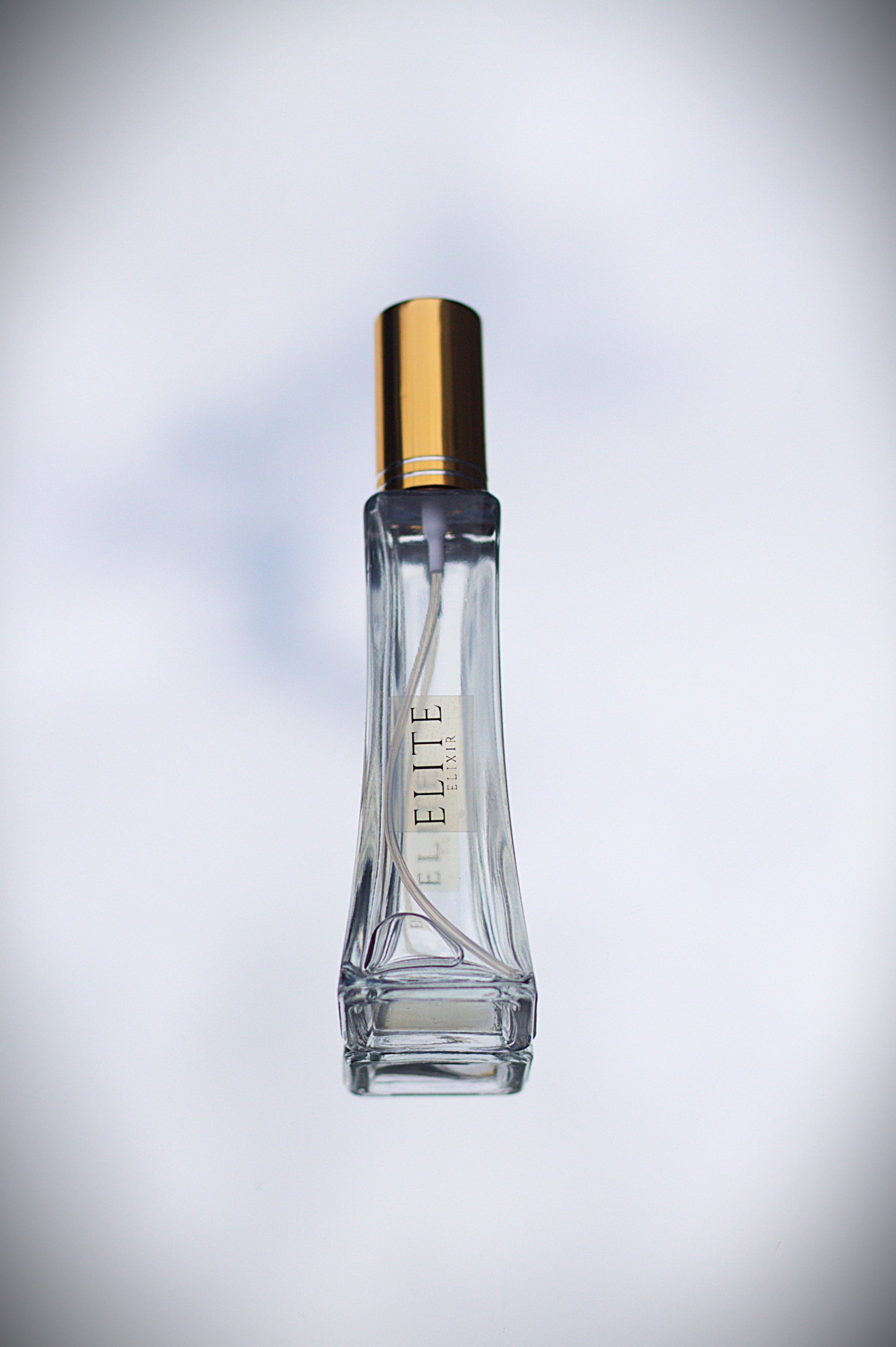 Azure Escape eau de parfum bottle with gold cap - Elite Elixir designer-inspired fragrance